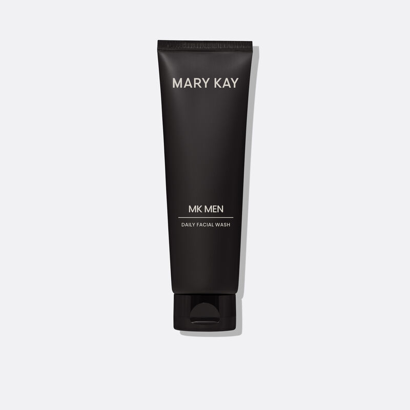 Bottle of MKMen Daily Facial Wash standing on its cap against a plain background