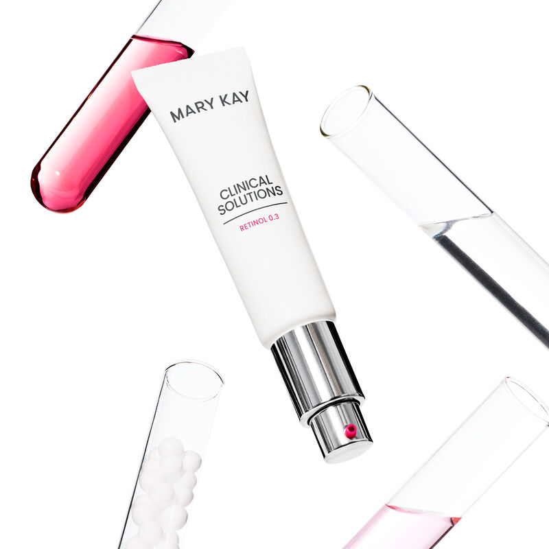 Product tube and test tubes with pink liquid