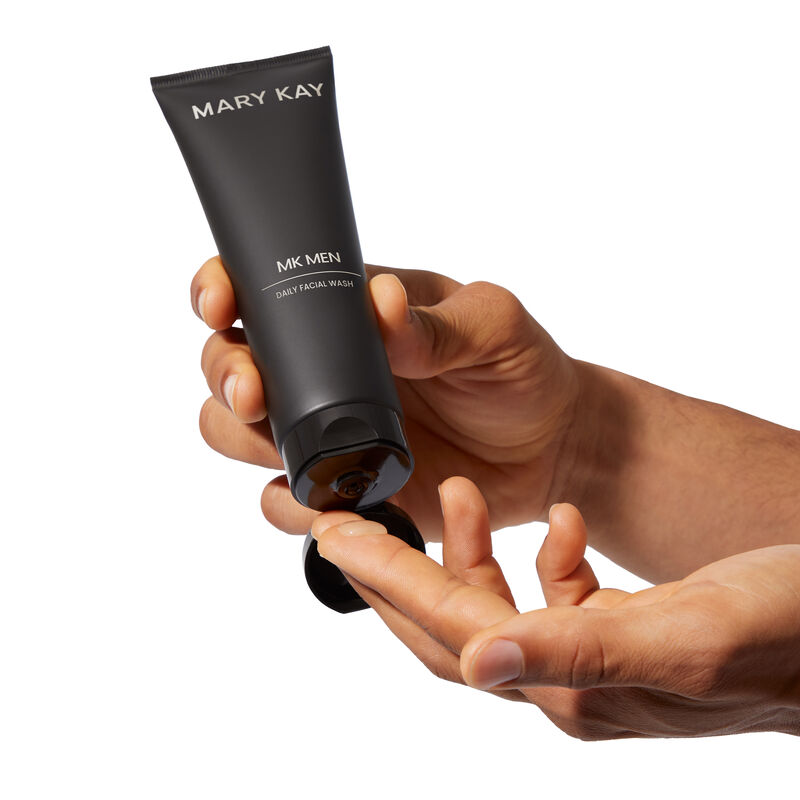 MKMen Daily Facial Wash being squeezed onto a man&rsquo;s fingers